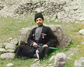 Sunni Muslim man wearing traditional dress and headgear.jpg