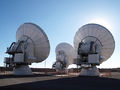 Three ALMA antennas close together on Chajnantor.jpg